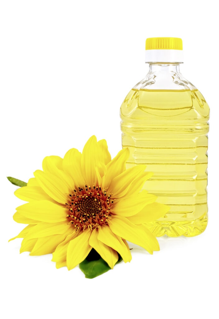 Sonnenblumenöl in Flasche mit Sonnenblumenblüte