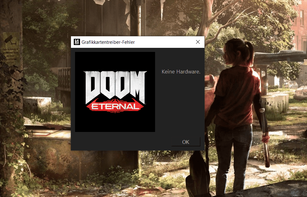 Screenshot Desktop mit schwarzem Kasten in dem Doom-Logo zu sehen ist und Fehlermeldung