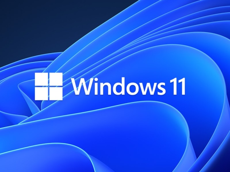Blaue Form auf schwarzem Grund mit Windows 11 Logo