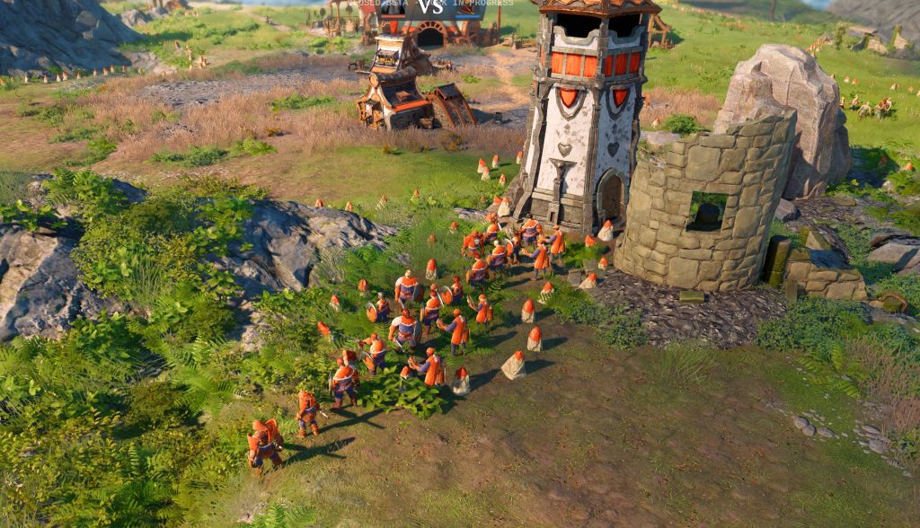 Screenshot bunte Landschaft mit Figuren in Reihe vor Turm