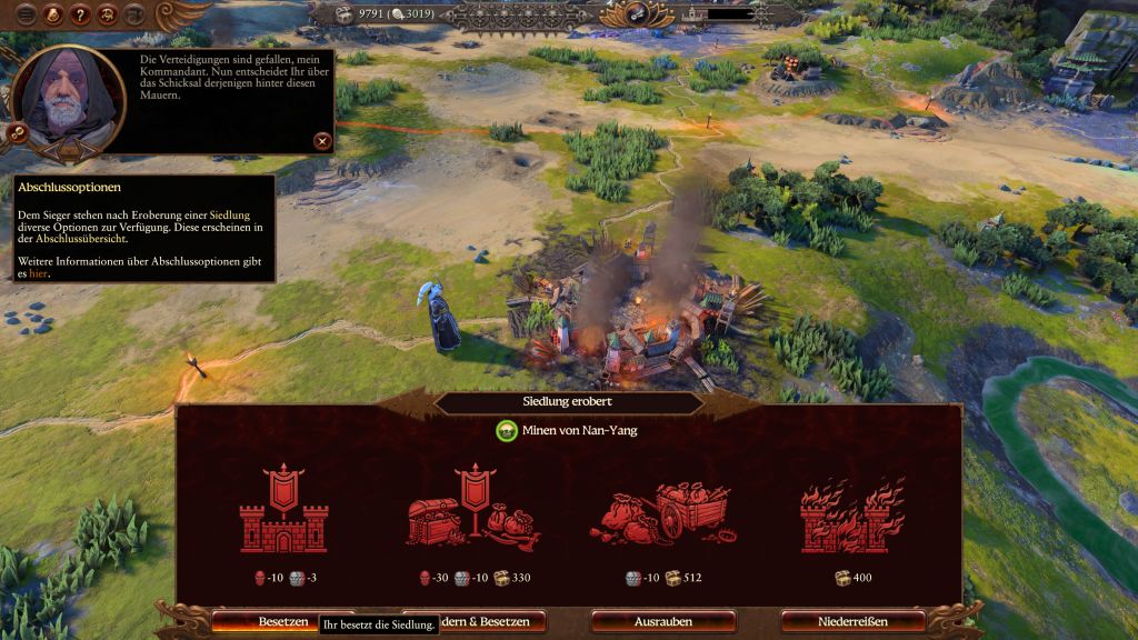 Screenshot aus Total War: Warhammer 3 zeigt Landschaft mit zerstörten Gebäuden von oben mit Menüleiste unten