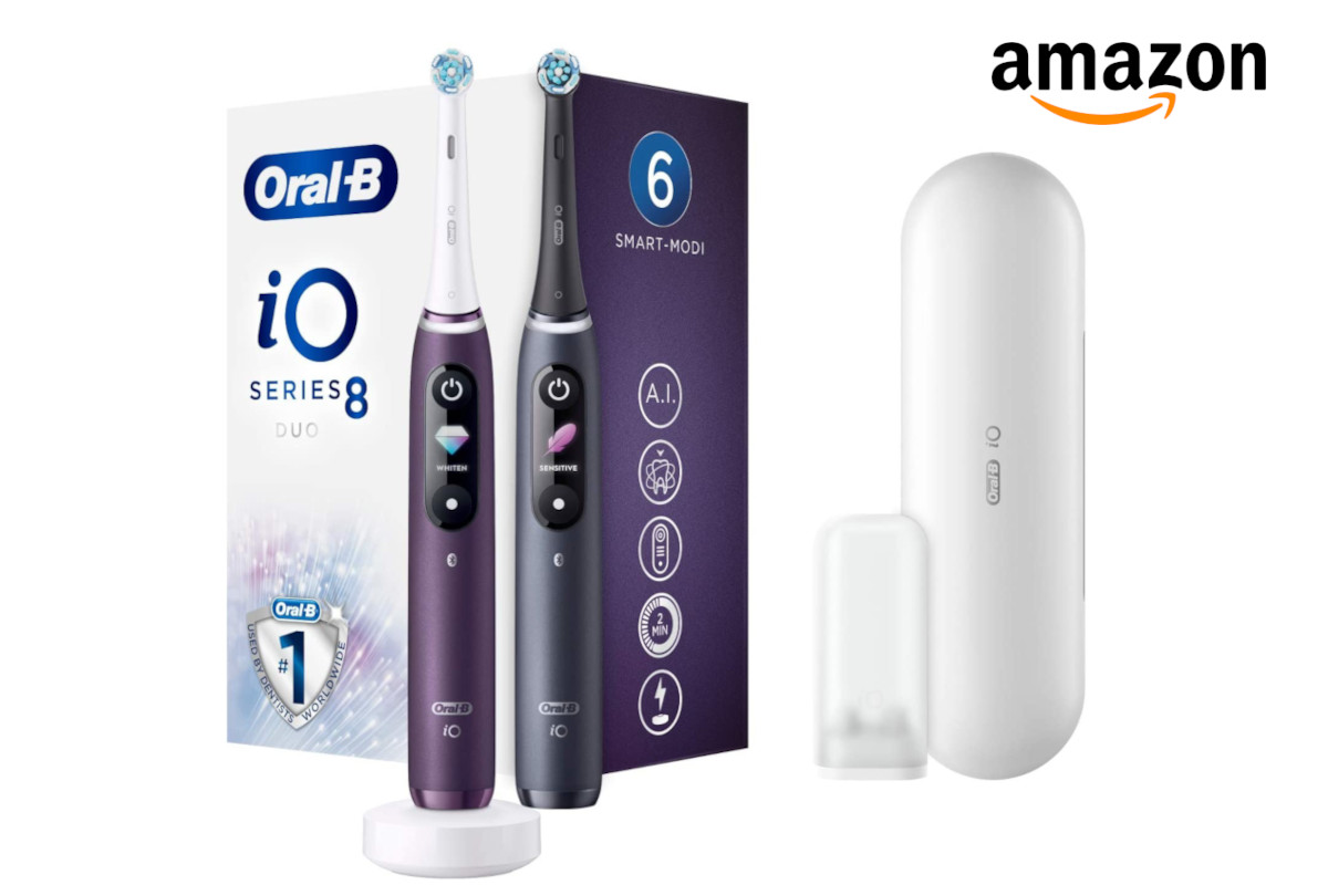 Oral-B iO zweimal in lila und in schwarz nebeneinander vor Karton, daneben weißes Etui, oben recht Amazon-Logo