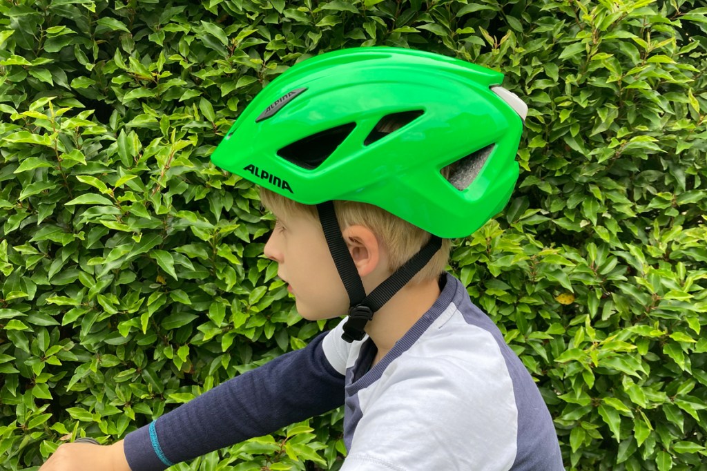 Alpina Pico Flash children's bicycle helmet, seen from the side on a child's head