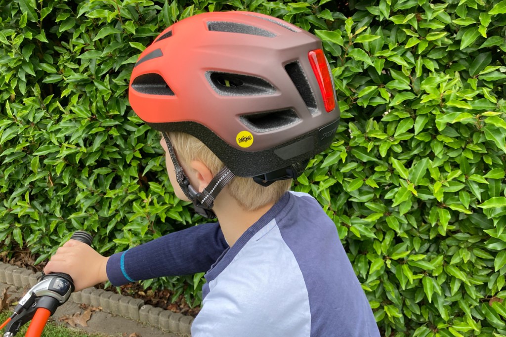 Specialized Shuffle Child LED children's bicycle helmet, seen from the side from behind, on a child's head
