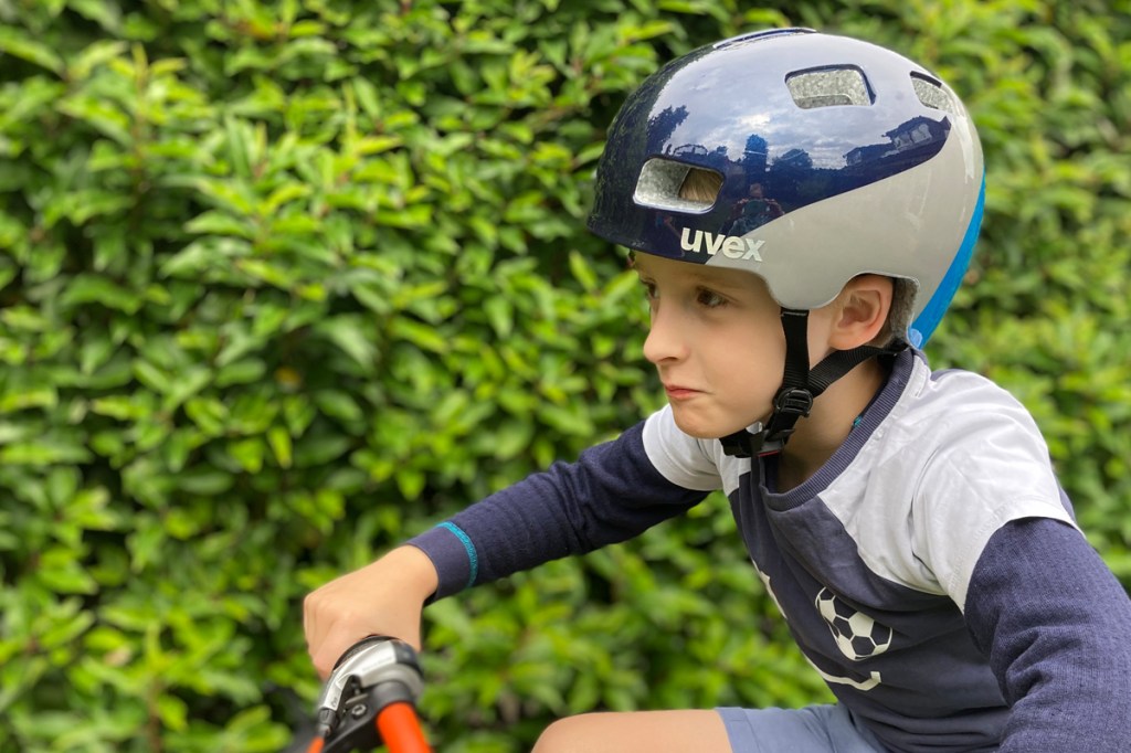 Uvex hlmt 4 kids bike helmet, side view, on the head of a child