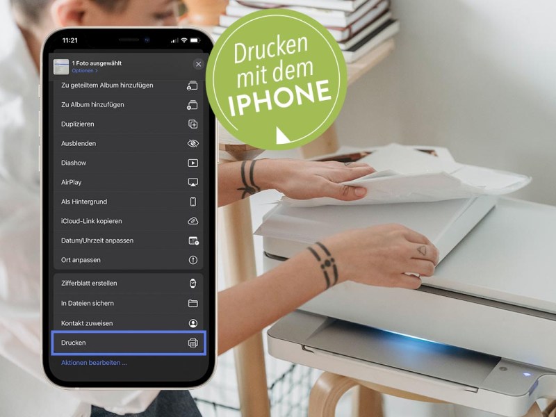 Ein iPhone vor einem Drucker.