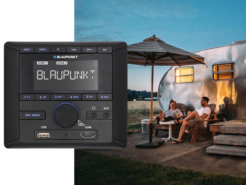 Audio-Zentrale von Blaupunkt vor einem Bild von Campern.