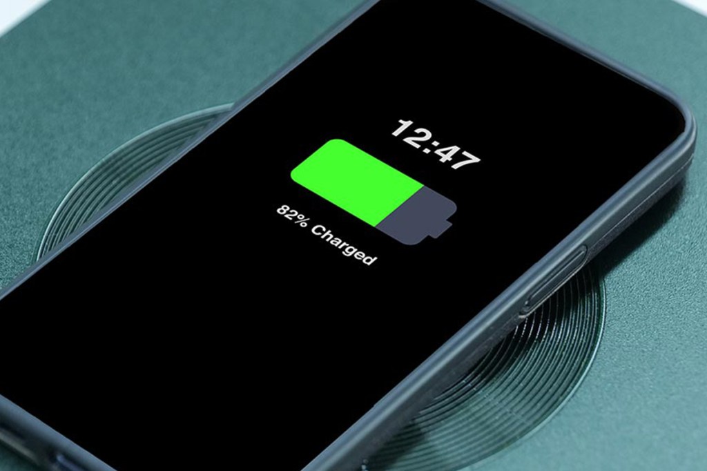 A mobile phone is charged wirelessly at an Immotor Bay Power Station.