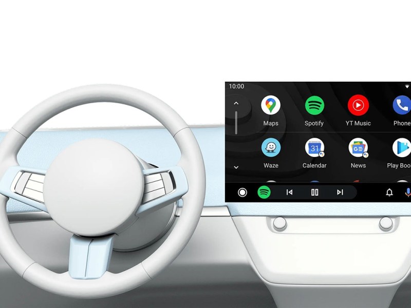Grafische Abbildung eines Auto-Cockpits mit Lenkrad und Infotainmentsystems. Im Display wird der App-Launcher von Android-Auto abgebildet.