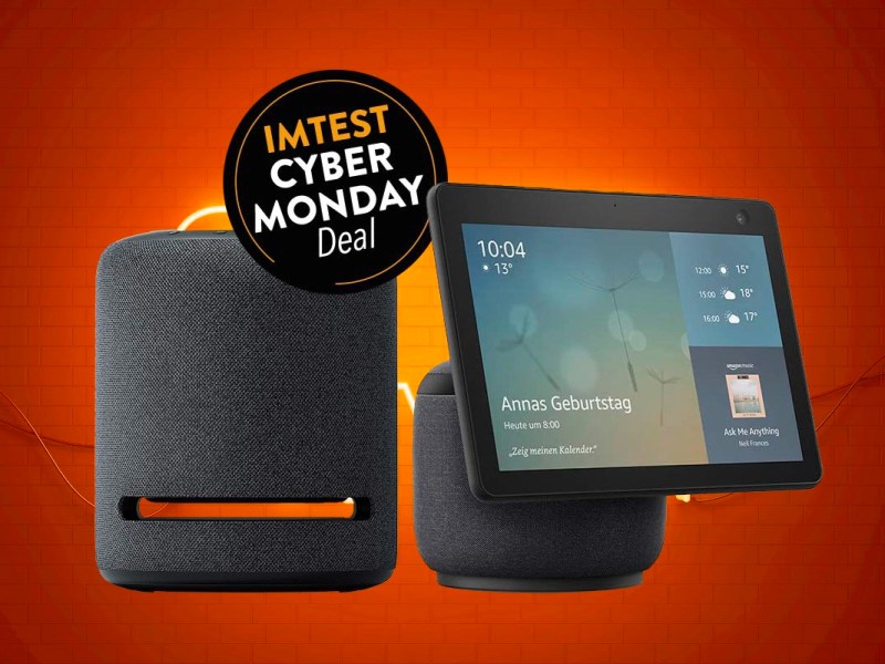 Schwarzer Amazon Echo Studio und Show 10 vor orangenem Hintergrund mit Button IMTEST Cyber Monday Deal