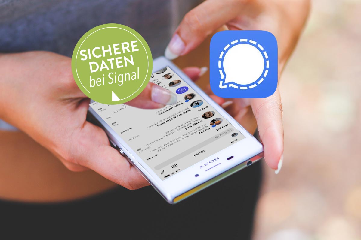 In der Hand gehaltenes Smartphone, das den Messenger-Dienst "Signal" geöffnet hat