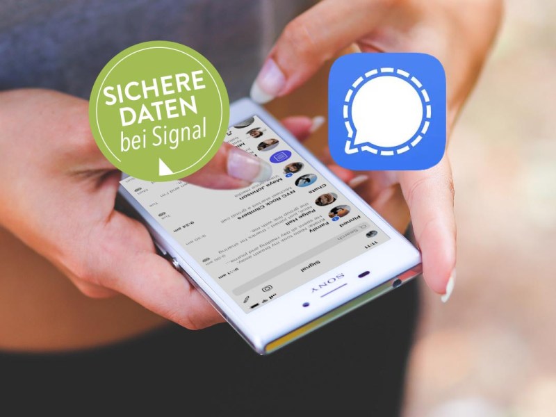 In der Hand gehaltenes Smartphone, das den Messenger-Dienst "Signal" geöffnet hat