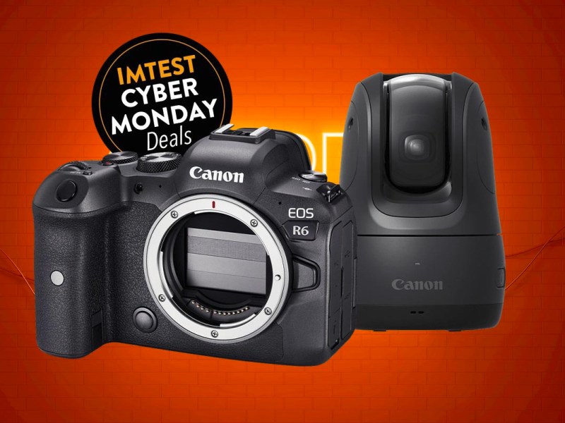 Schwarze Canon Kamera neben Kompaktkamera vor orangenem Hintergrund und schwarzem Button IMTEST Cyber Monday Deal