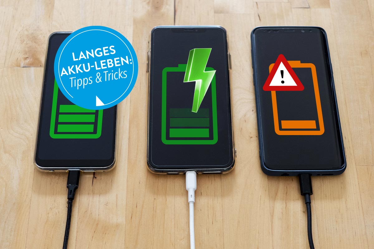 Drei Smartphones auf einem Tisch liegend