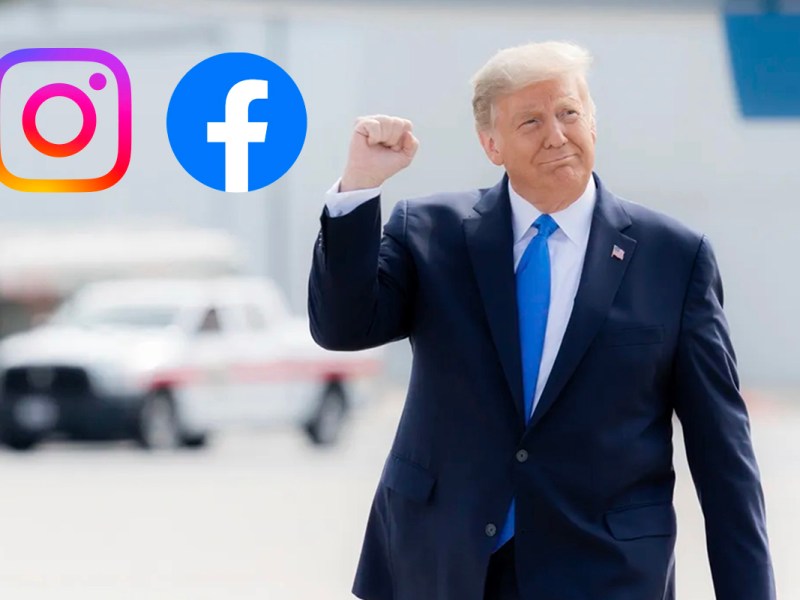 Donald Trump läuft mit erhobener Faust über einen Platz.