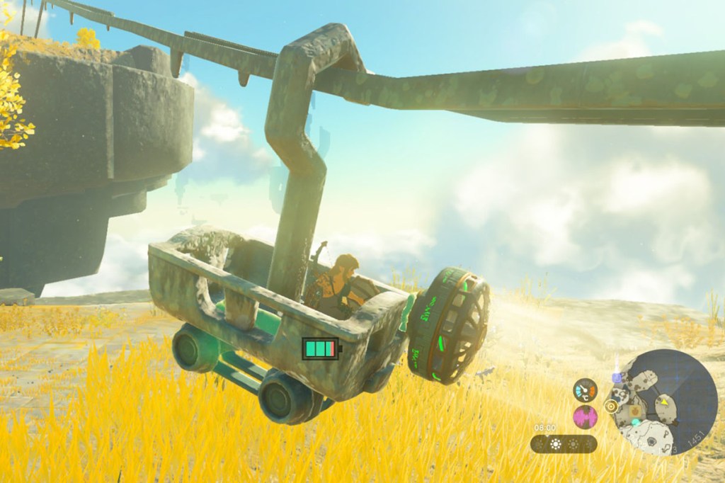 Ein Screenshot aus Zelda: Tears of the Kingdom. Ein seltsames Gefährt rutscht ein Metallrohr herab.