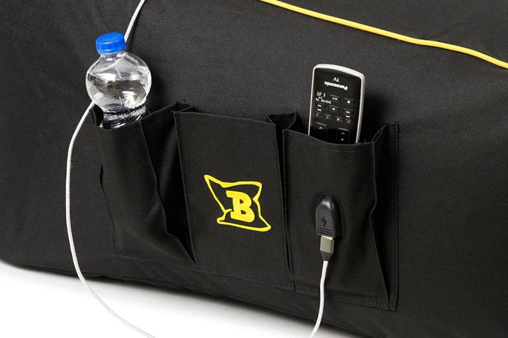 Black and yellow beanbag detailing on the side with three pockets with water bottle and power station