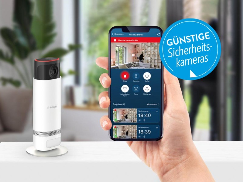 Sicherheitskamera von Bosch neben einem Smartphone mit geöffneter App.
