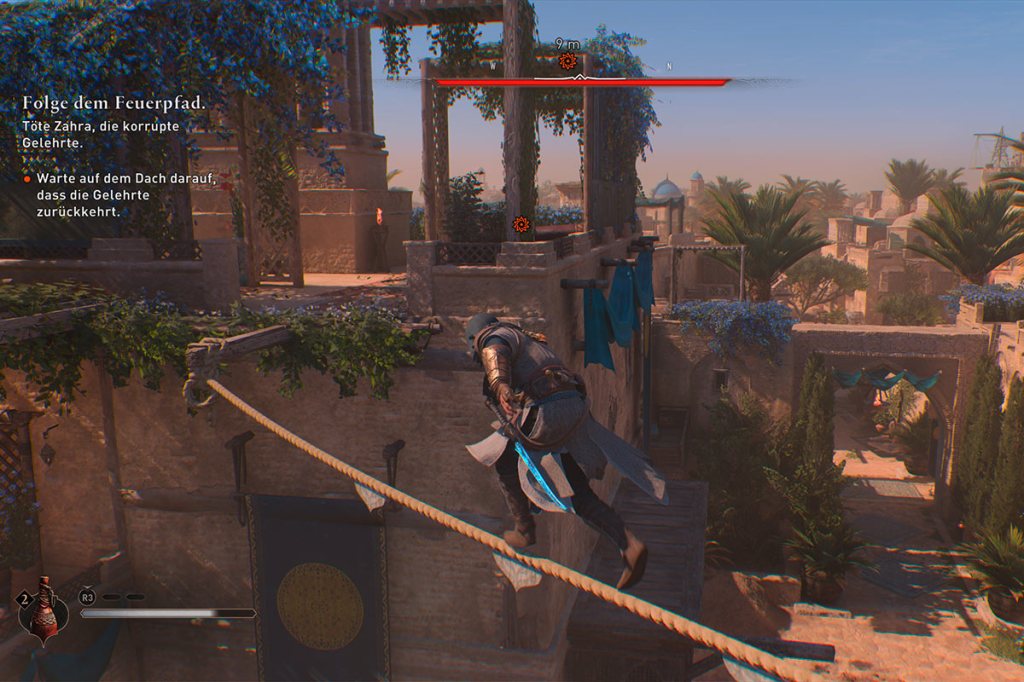 Ein Screenshot aus dem Spiel Assassin's Creed Mirage, zu sehen ist wie Basim auf einem Seil über einen Abgrund läuft.