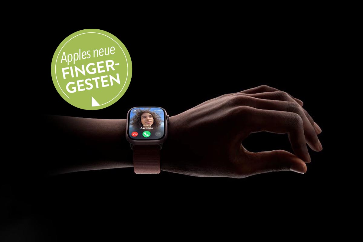 Apple Watch an einer Hand auf schwarzem Grund.