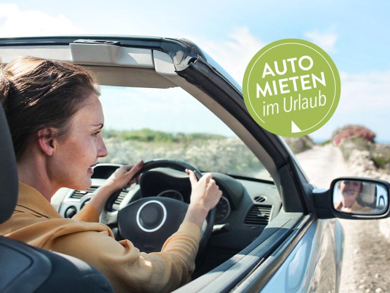 Person in einem Auto fahrend.
