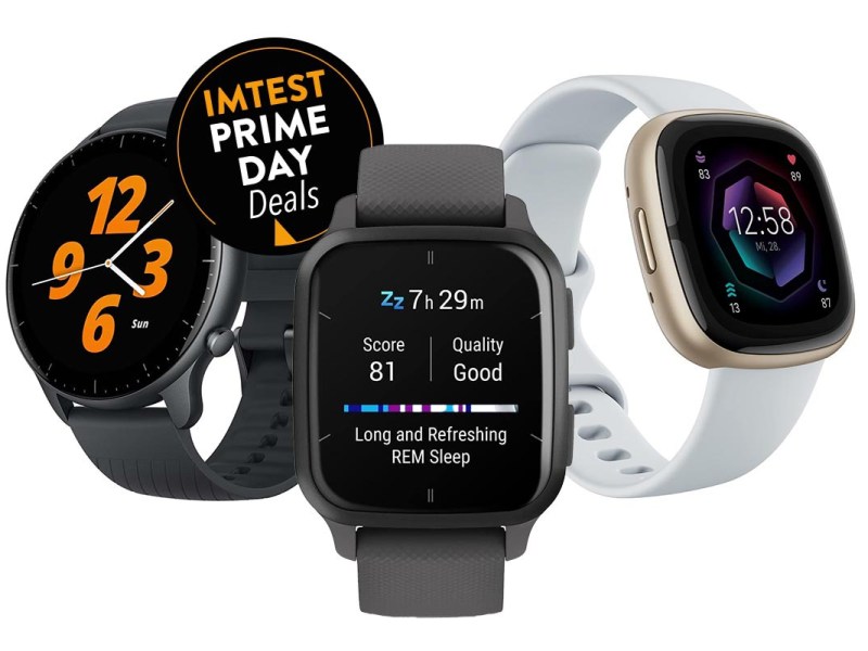 Drei Smartwatches sind nebeneinander angeordnet. Oben links ist ein schwarzer Button mit dem Text "IMTEST Prime Day Deals".