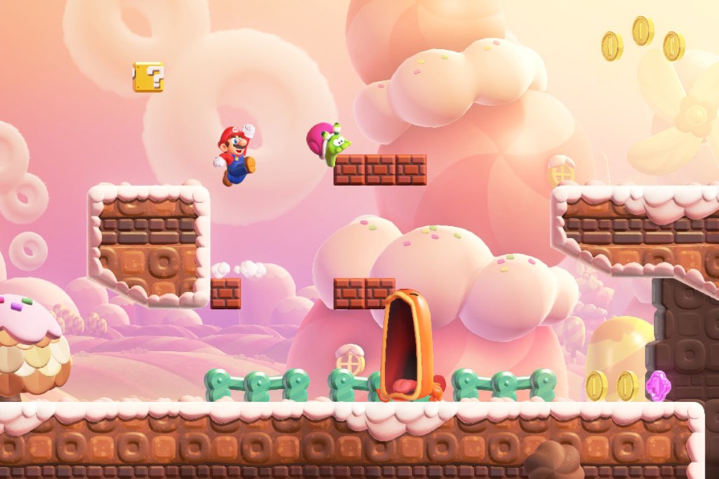 Screenshot aus dem Spiel Super Mario Bros. Wonder. Man sieht ein rosa Land, Mario hüpft gerade.