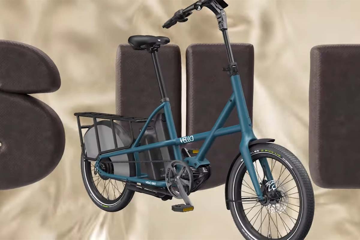 Cargo-E-Bike vor einem braunen Hintergrund, der die Buchstaben S U B zeigt