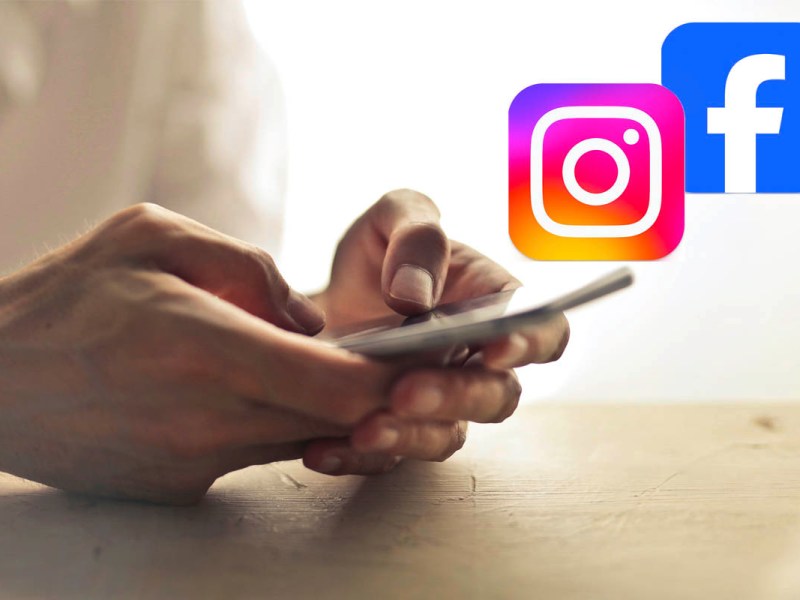Ein Mensch hält ein Handy, daneben sind Logos von Instagram und Facebook zu sehen.