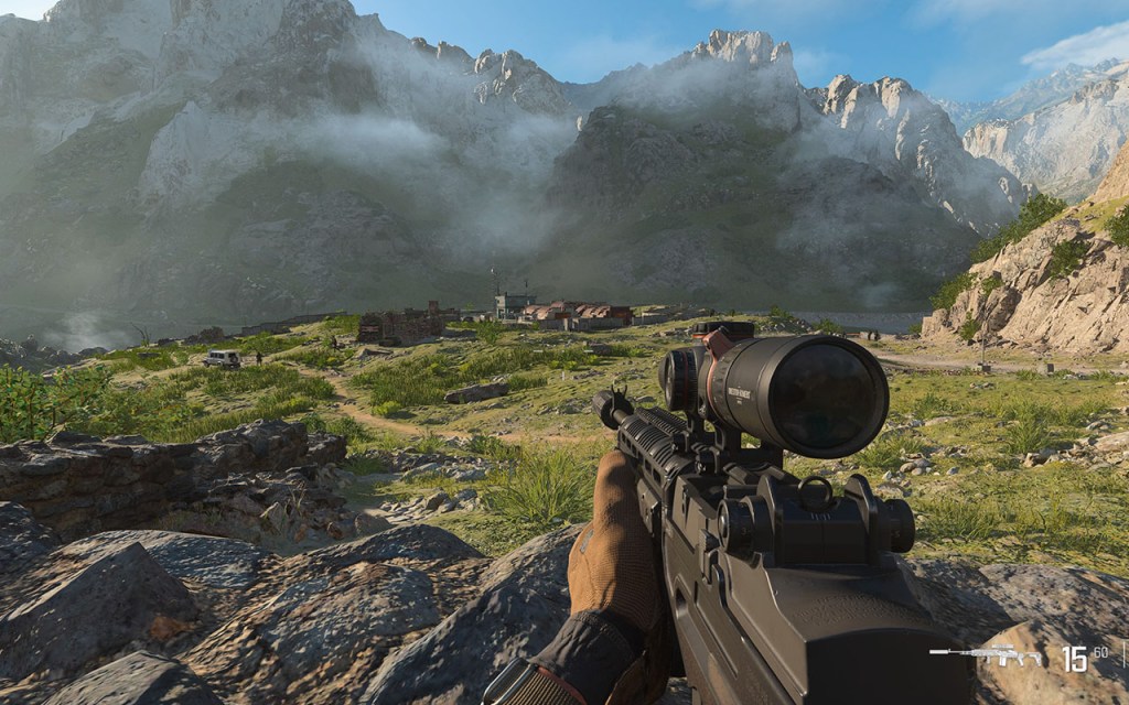 Screenshot aus dem Shooter Modern Warfare 3. Der Spieler schaut auf eine Militärbasis, im Hintergrund ein Berg-Panorama.