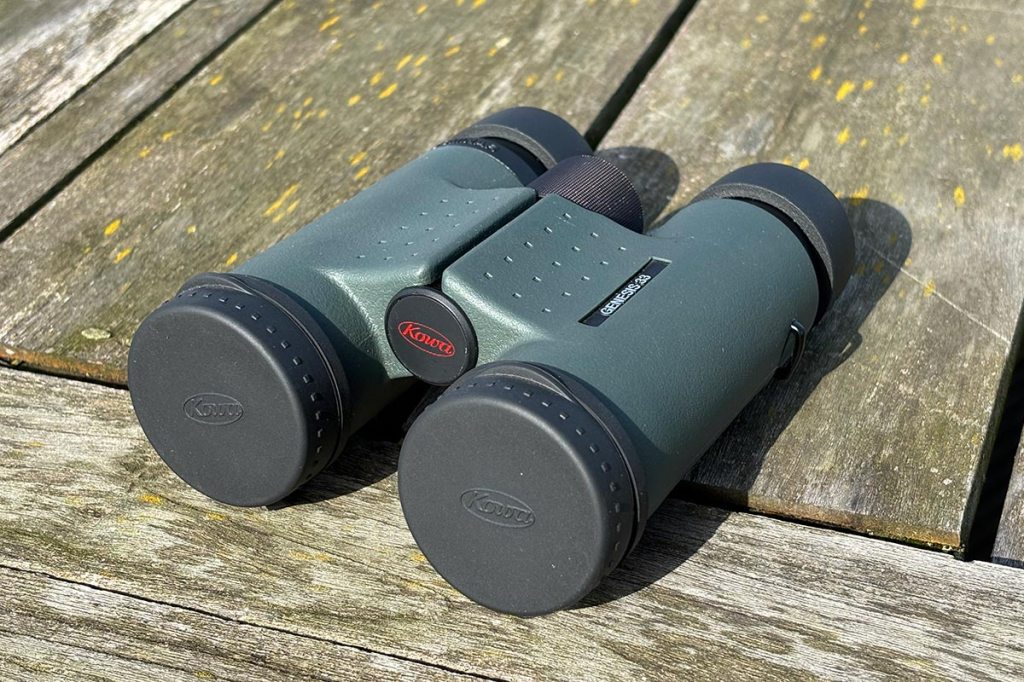 Kowa Genesis Prominar 8x33 Binoculars, with protective lens covers.