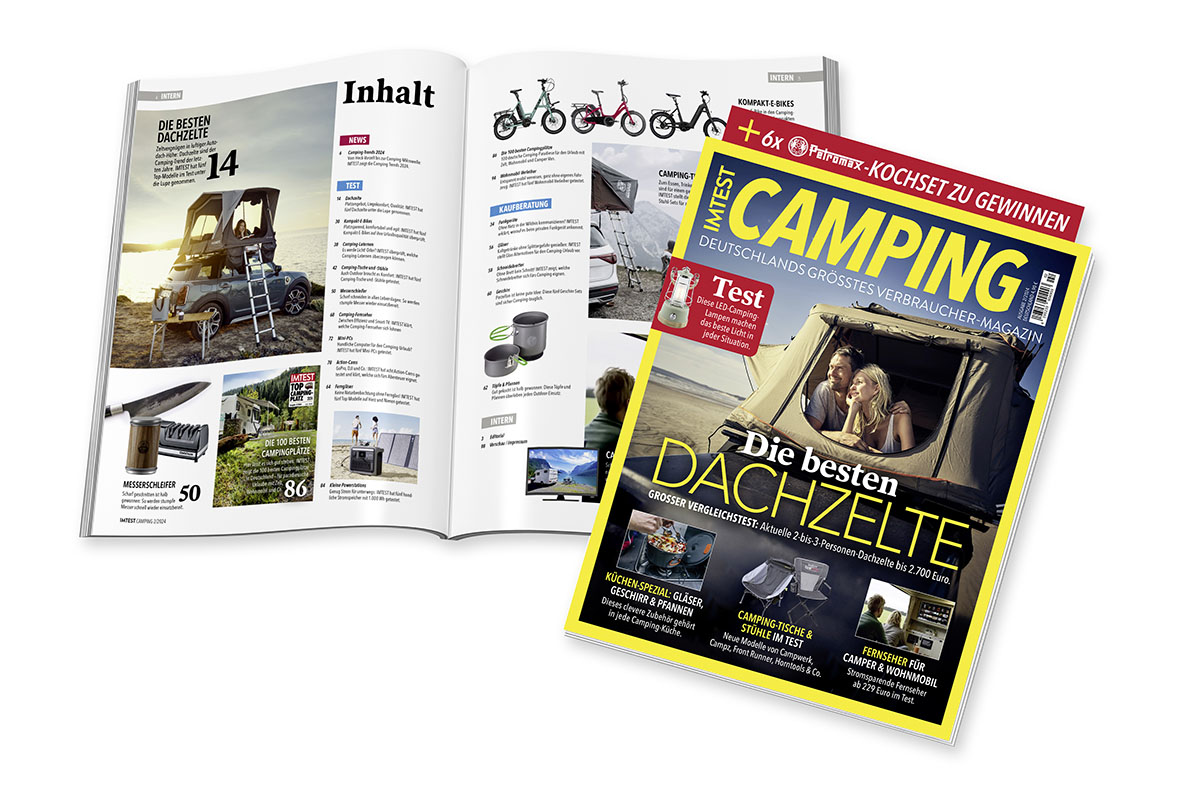 IMTEST 2/24 Camping-Magazin liegt aufgeklappt hinter einer zusammengeklappten Ausgabe.