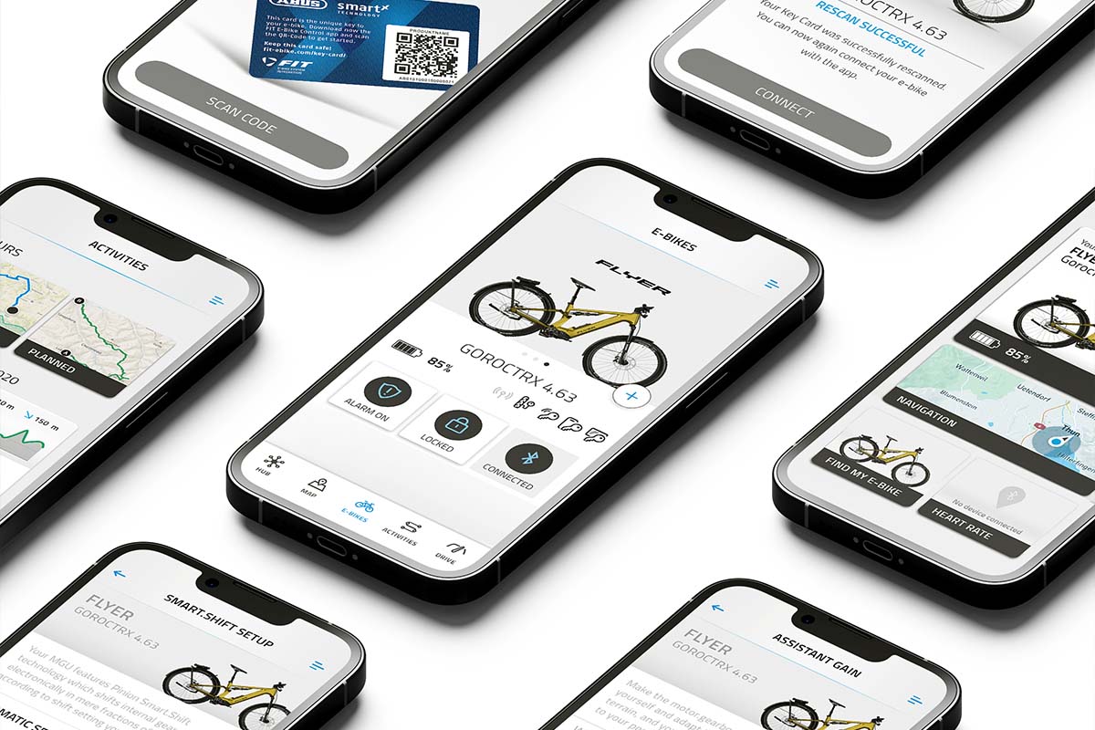 Mehrere Smartphones mit einer E-Bike-App nebeneinanderliegend
